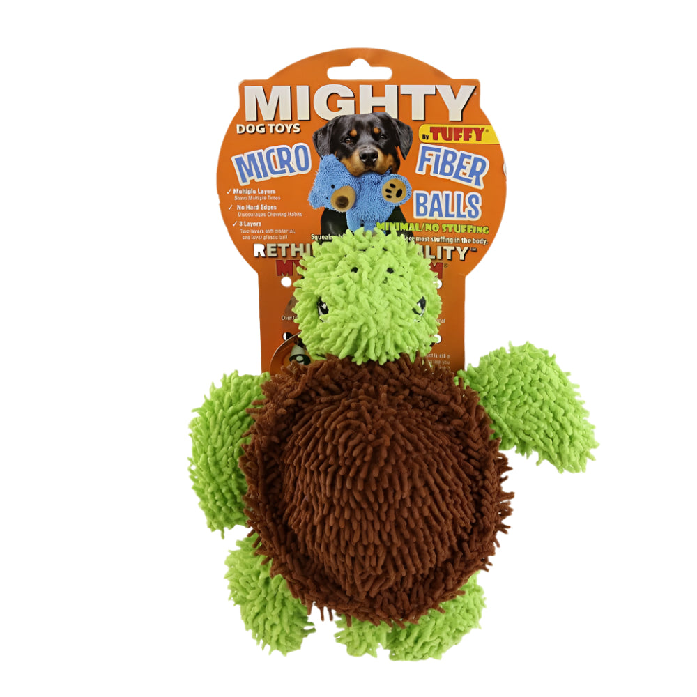 A green and brown plush turtle dog toy in its packaging, branded as a "Mighty Microfiber Ball" by Tuffy, designed for durability and interactive play.
