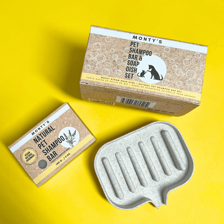 Monty's pet shampoo bar and soap dish set displayed on a vibrant yellow background, highlighting eco-friendly, natural pet care packaging.