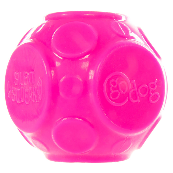 Bright pink GoDog Silent Squeak ball dog toy with textured surface for quiet indoor play.