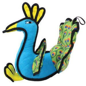 Side profile of a peacock-shaped dog toy featuring a blue body, vibrant yellow beak, and detailed green tail feathers with reinforced edges for long-lasting fun.