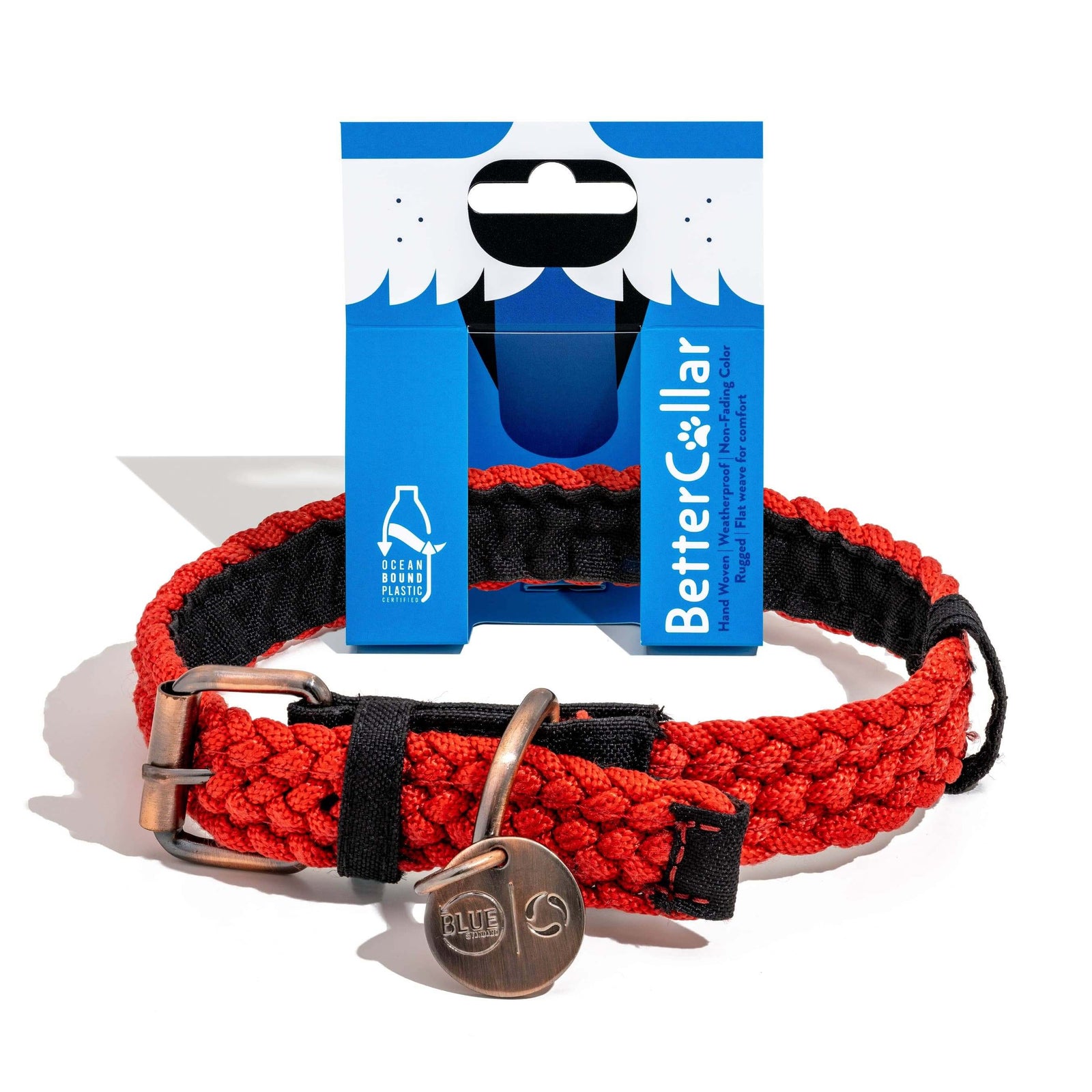 A red and black woven dog collar with a metal clasp displayed in front of its packaging which reads 'BetterCollar'.