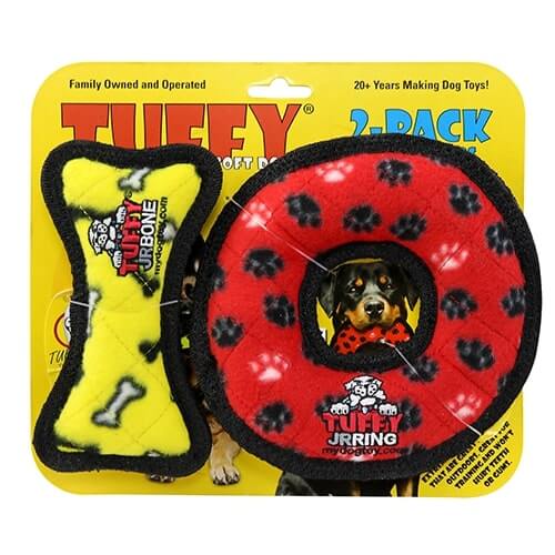 Tuffy dog toy 2-pack featuring a yellow bone-shaped toy and a red ring-shaped toy with black paw prints, packaged on a bright yellow background.