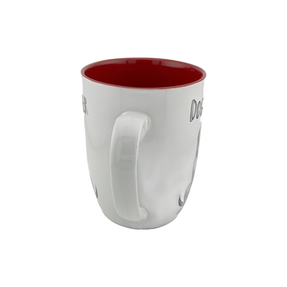 A white ceramic mug with a red interior, viewed from the back, showing the handle. The mug features a simple and clean design, with "Dog Lover" text partially visible from this angle. This 24 oz mug is ideal for dog lovers and adds a vibrant pop of color to your drinkware. Dishwasher and microwave safe.