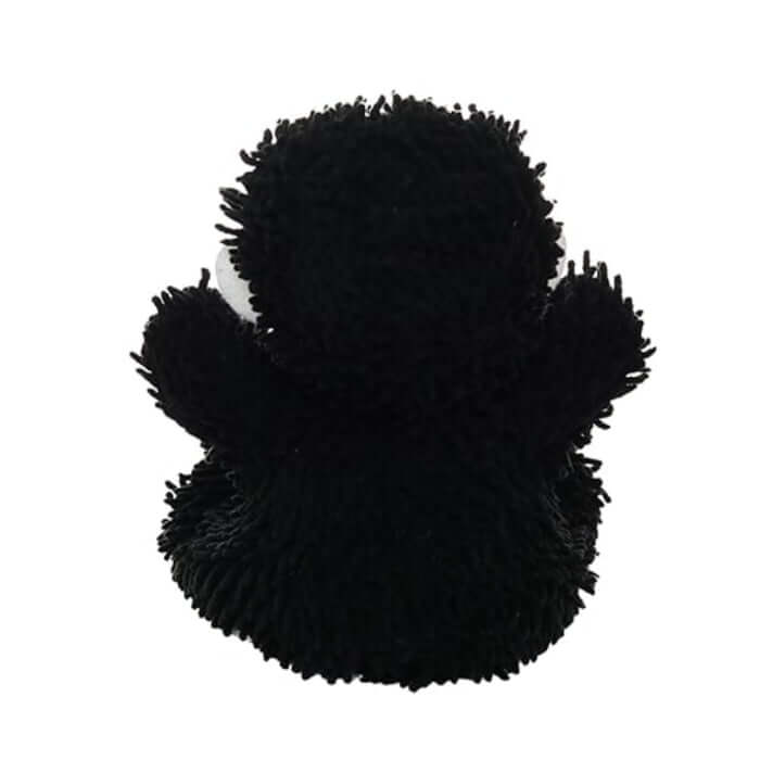 Back of to black plush dog toy on a white background