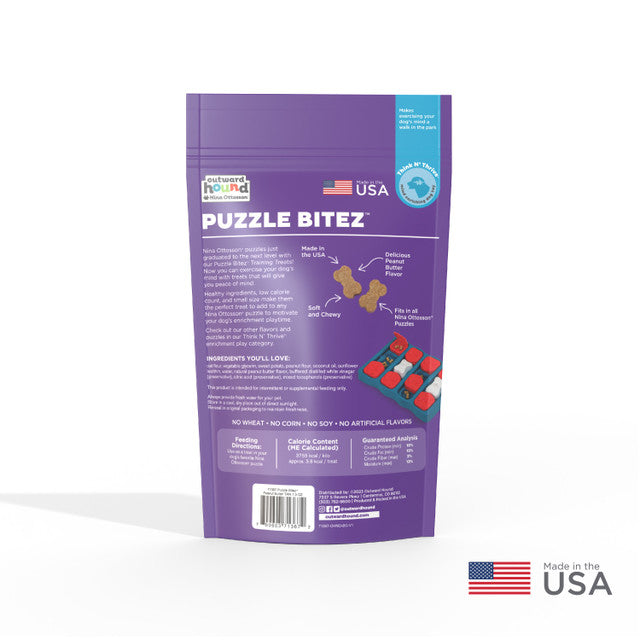 Back of the Puzzle Bitez dog training treats bag, listing ingredients, calorie content, and highlighting peanut butter flavor, made in the USA.