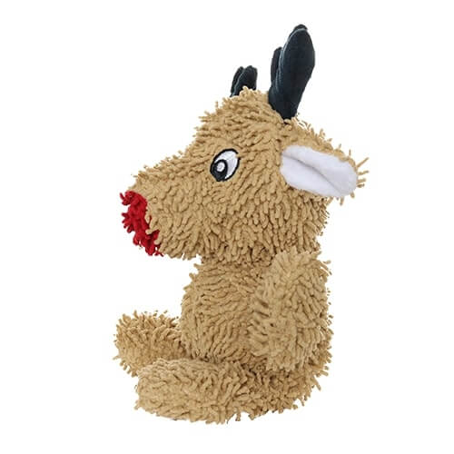 A side view of the reindeer plush dog toy sitting upright, highlighting its fluffy texture and red nose.