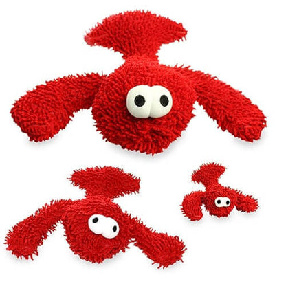 Three red plush dog toys with large white and black eyes, featuring textured, shaggy surfaces and designed for interactive play.