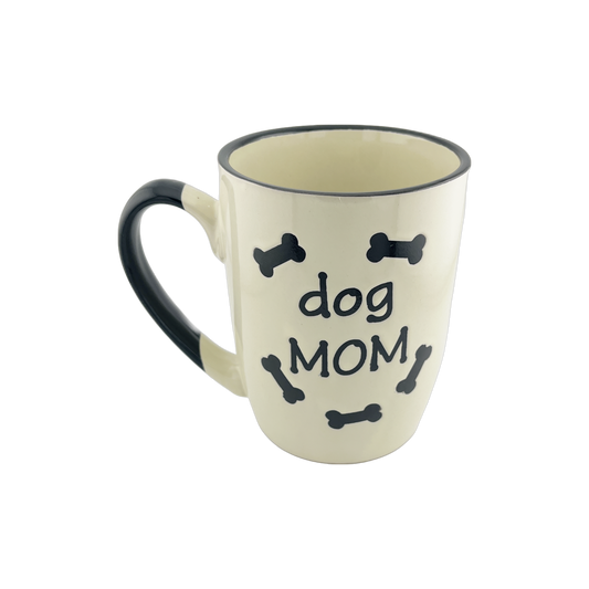 A ceramic mug with a white base and black handle, featuring the text 'dog DAD' in the center surrounded by small black bone shapes. The mug has a simple and clean design, suitable for dog lovers, especially those who consider themselves dog dads.