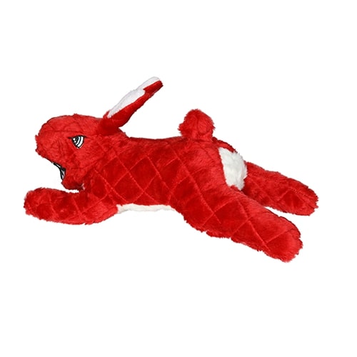 A red plush dog toy in the shape of a rabbit, featuring quilted fabric, white accents on the belly and tail, and floppy ears.