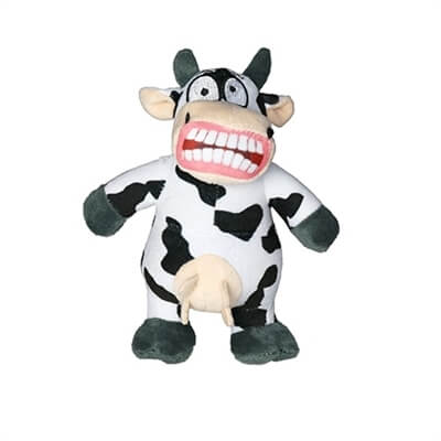 Small plush cow-shaped dog toy with black spots, a wide grin showing large teeth, and udders, featuring a comical and exaggerated expression