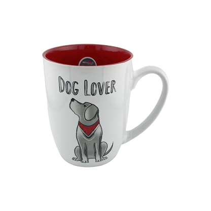 A white ceramic mug with a red interior, featuring an illustration of a sitting dog wearing a red bandana. The text "Dog Lover" is displayed above the dog graphic. This 24 oz mug is perfect for dog lovers, adding a pop of color to your drinkware collection. Dishwasher and microwave safe.