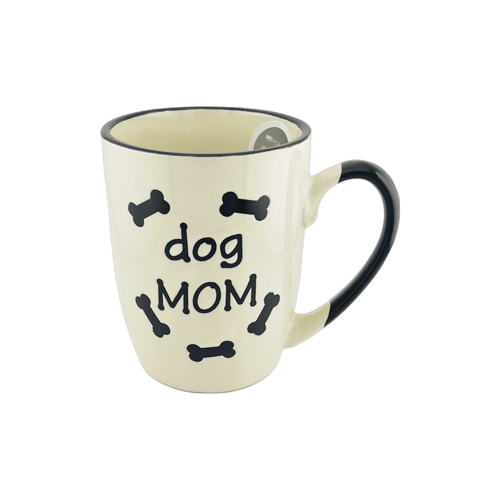 A small ceramic mug with a white base and black handle, featuring the text "dog MOM" surrounded by small black bone shapes. The design is simple and appealing, ideal for dog lovers, especially those who identify as dog moms.