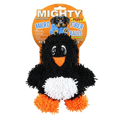 The black plush penguin dog toy in its original packaging labeled "Mighty Microfiber Balls," with a fluffy texture, orange beak, and feet.