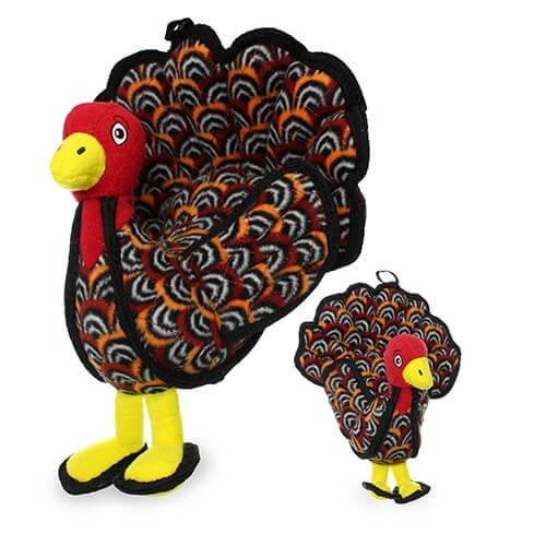 Two plush turkey-shaped dog toys with colorful feather patterns, red heads, and yellow feet, in large and small sizes.