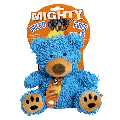 Mighty® Micro Ball Bear Dog Toy: Plush bear-shaped toy with a fuzzy blue body, brown nose, black embroidered eyes, and tan paw pads with black paw prints. Packaged with the Mighty® Micro Fiber Balls label. Soft and playful.