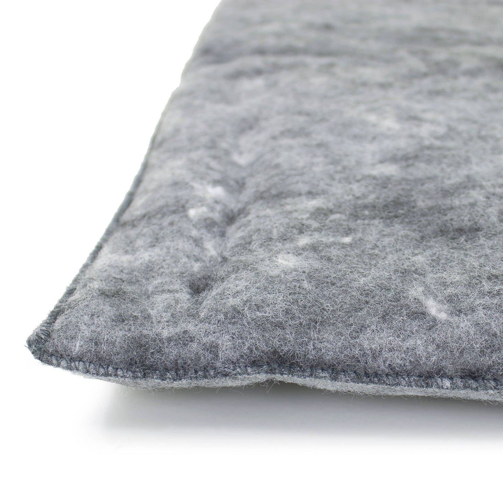 Close-up of a textured gray pillow on a white background