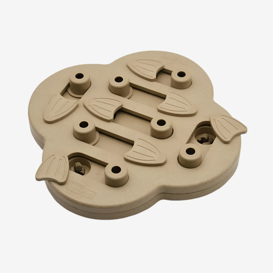 Close-up of the Outward Hound Hide N’ Slide puzzle game with movable levers and treat compartments—intermediate skill level enrichment toy.