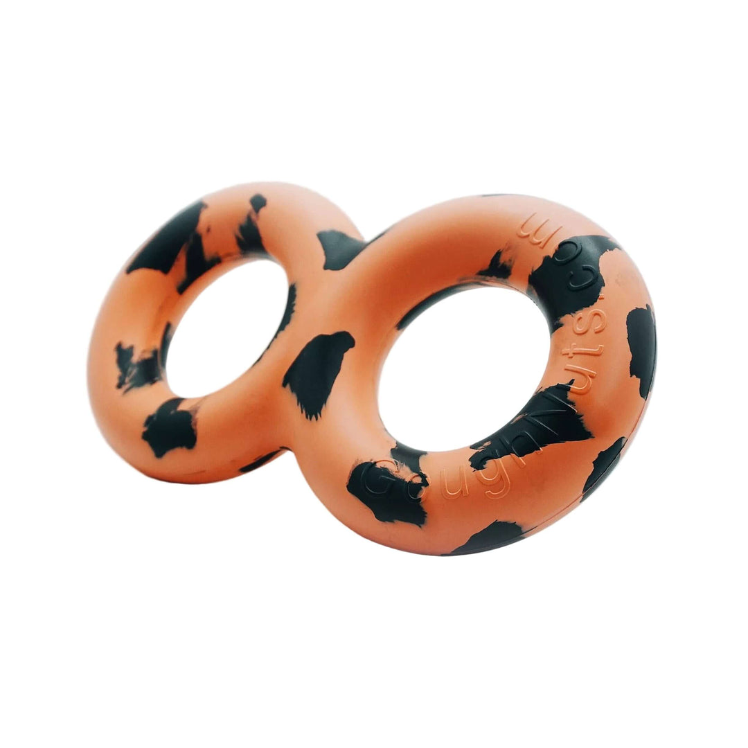 Orange and black dog toy shaped like a pretzel on a white background