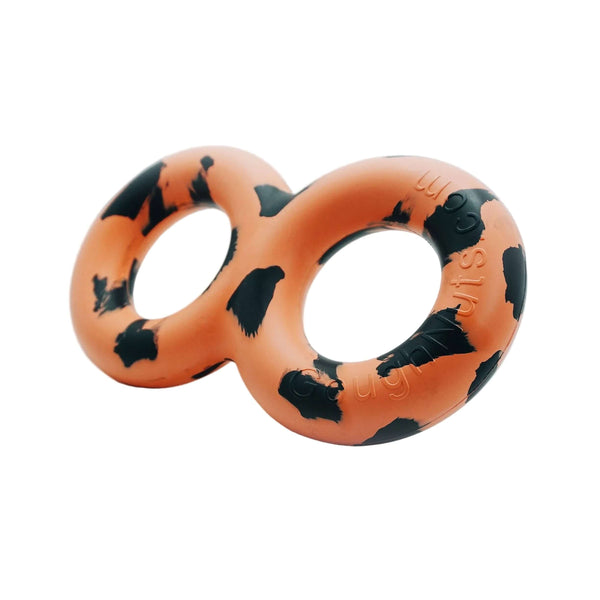 Orange and black dog toy shaped like a pretzel on a white background