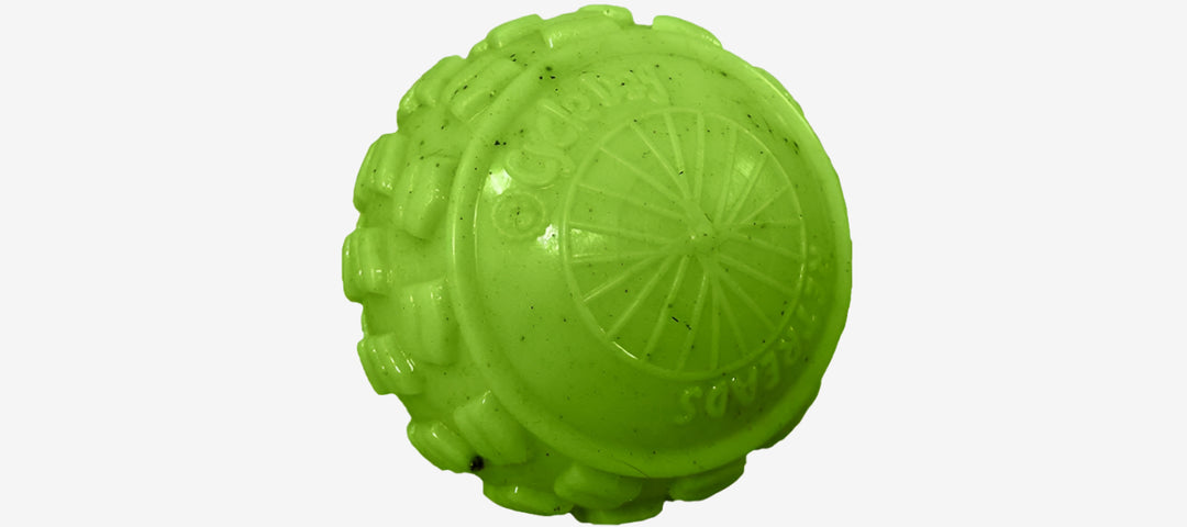 Three colorful rubber dog toys designed with a bumpy texture, in blue, green, and orange colors.