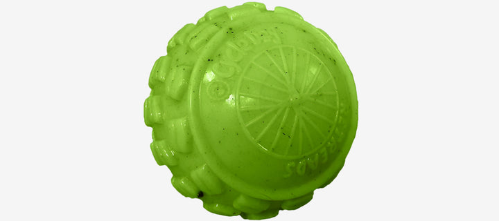 Three colorful rubber dog toys designed with a bumpy texture, in blue, green, and orange colors.