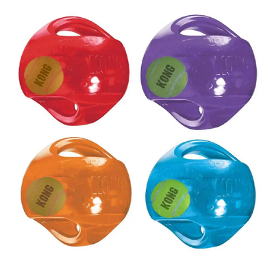 Four colorful KONG dog toys on a white background