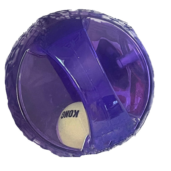 A purple translucent Kong ball dog toy containing a white tennis ball, shown against a plain white background.