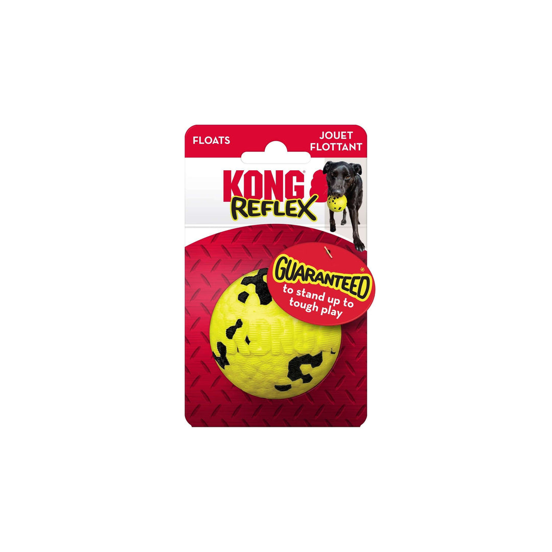 Yellow dog toy with black paw prints on a red KONG Reflex packaging.