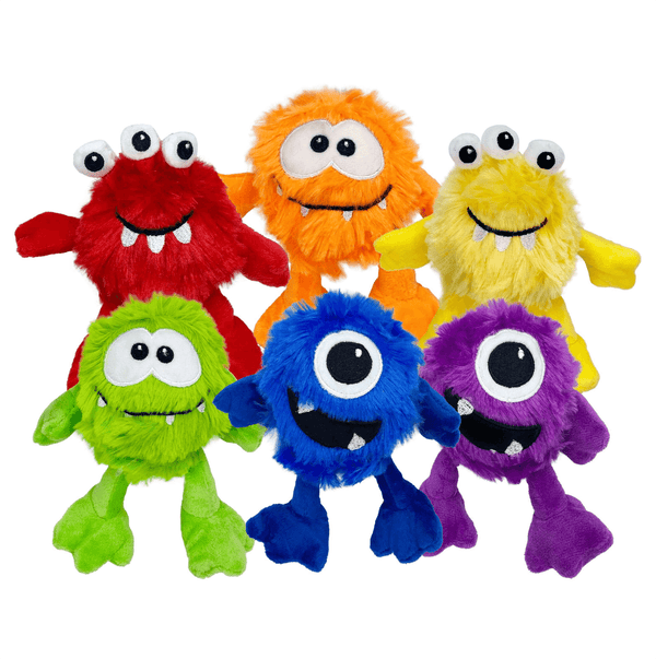 Set of colorful plush monsters on a white background