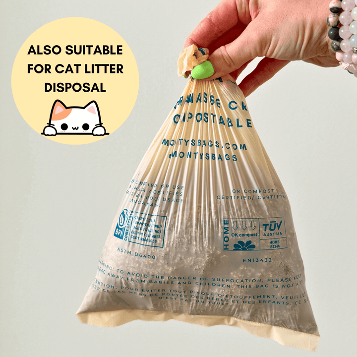 Hand holding Monty's compostable bag, labeled eco-friendly and suitable for cat litter disposal, with certifications for home composting.