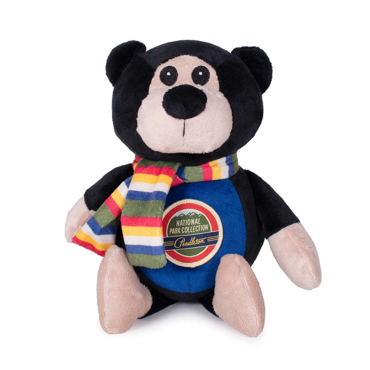 Close-up of Pendleton plush bear dog toy wearing a rainbow scarf from the National Park Collection – soft and cuddly dog gift.