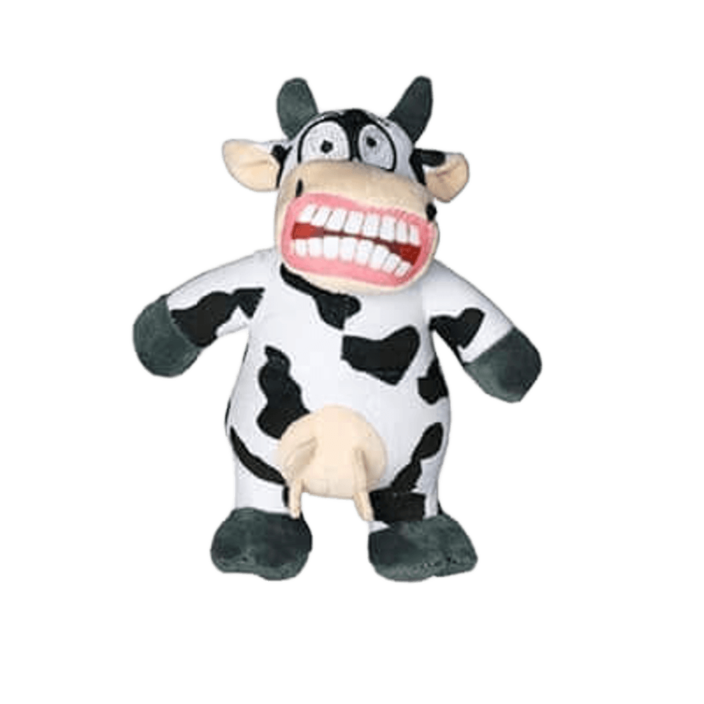 Cow-shaped dog toy with black and white plush body, wide eyes, a large grinning mouth with big teeth, and udder detail. Designed for fun interactive play.