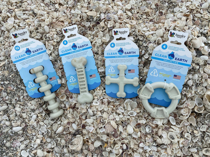 Spunky Pup Clean Earth chew toys collection featuring bone, ring, cross, and dumbbell designs, made from recycled plastic bottles, eco-friendly.