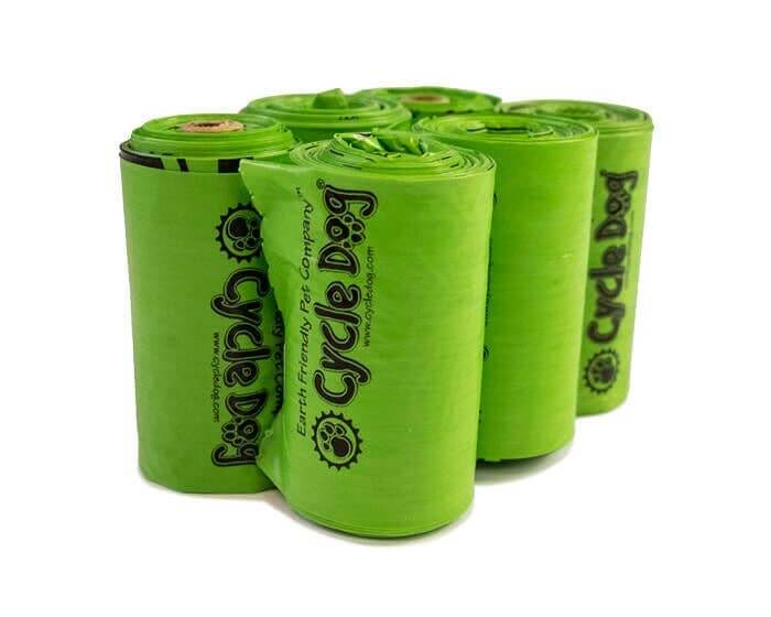 Six rolls of bright green Cycle Dog poop bags with Earth-friendly branding, made from renewable materials for dog waste cleanup.