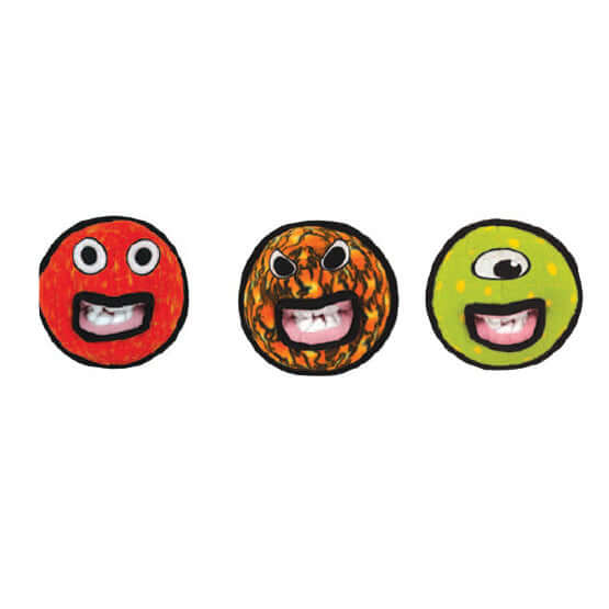 Three round toys with face designs on a white background