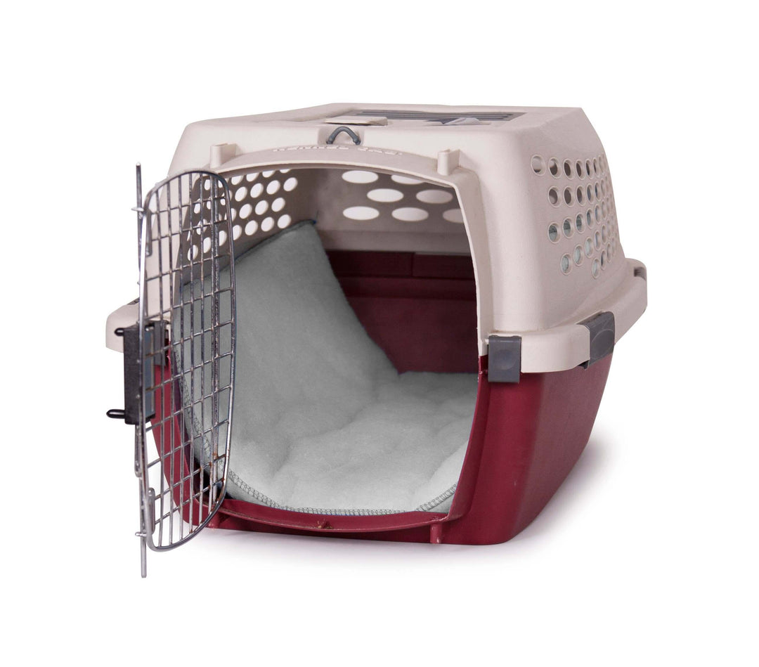 Pet carrier with a red base and beige top on a white background