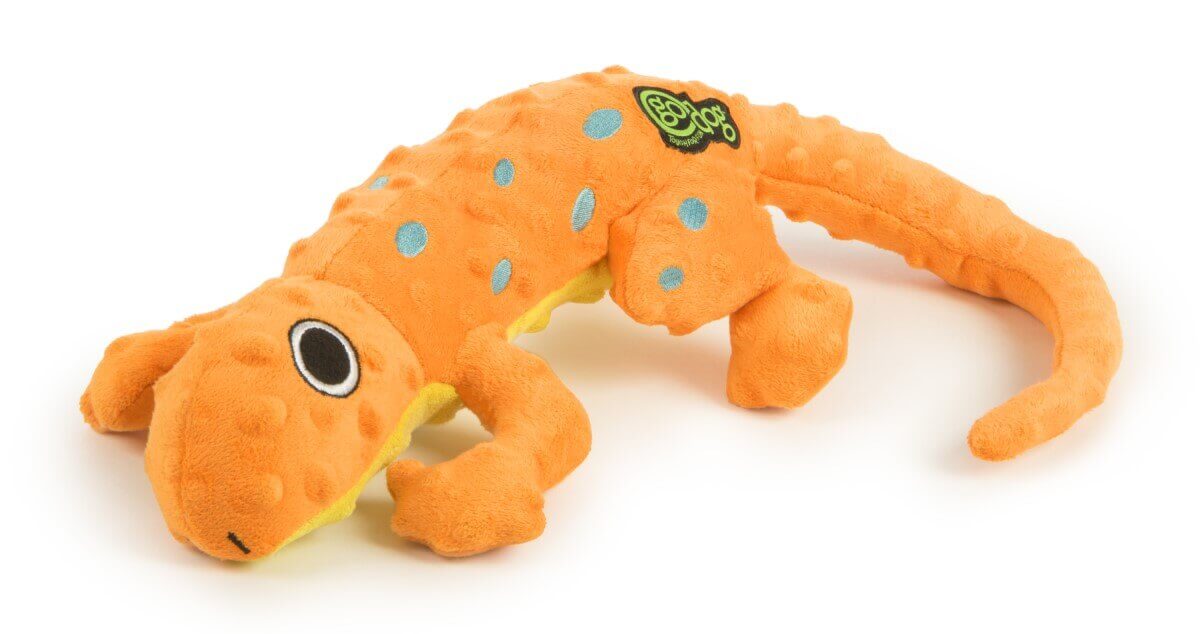 Plush orange lizard-shaped dog toy with large black and white eyes, blue spots, and a yellow underside, featuring the "goDog" logo, designed for interactive fun.