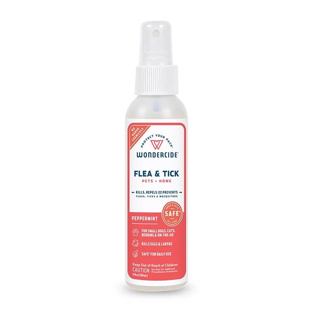 Spray bottle labeled 'Wondercide' for flea and tick control on a white background