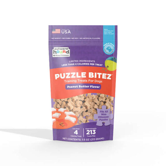 Puzzle Bitez dog training treats in peanut butter flavor by Outward Hound, showing small bone-shaped treats and limited ingredients on the packaging.