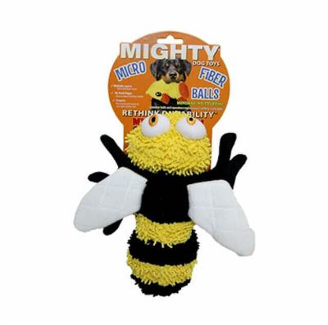 The image depicts a MIGHTY® Dog Toy called "Microfiber Ball Bee." The toy is designed to resemble a bee, with a fuzzy yellow and black striped body. It has a round yellow head with large, expressive white eyes with orange pupils. The bee toy also features white wings and black legs. The packaging indicates that the toy is part of the MIGHTY® Microfiber Ball series, known for their durability and minimal stuffing, making them suitable for interactive play with dogs.