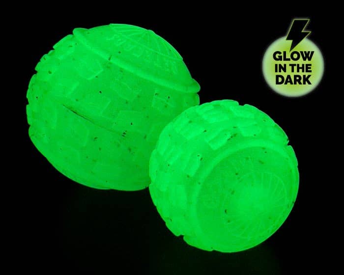 Two green glow-in-the-dark balls on a black background with a label indicating 'Glow in the Dark'.