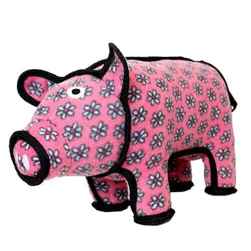 Side view of a plush pig dog toy from Tuffy, featuring a pink body with a floral pattern and black outlines.