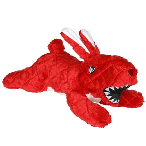 A red rabbit-shaped plush dog toy with quilted fabric, white ear and tail accents, and an open mouth showing playful sharp teeth.