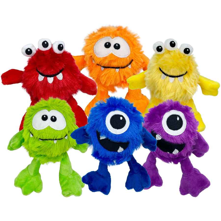Set of colorful plush monsters on a white background