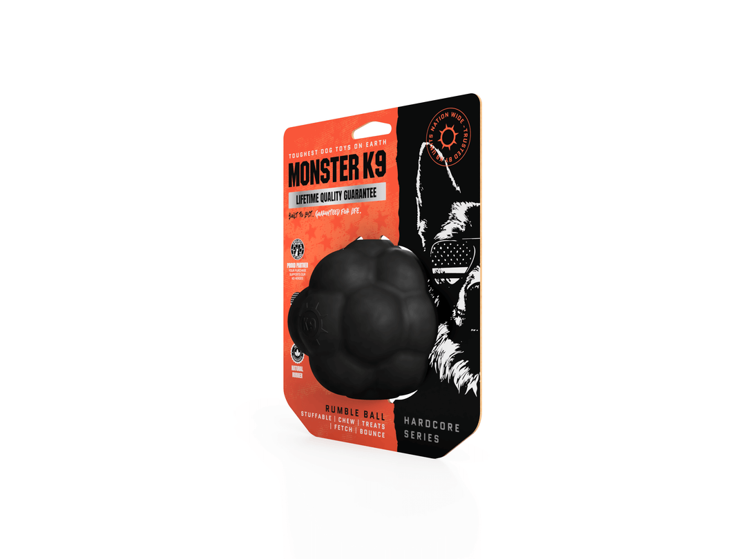 Black rubber ball with Monster K9 packaging on a white background