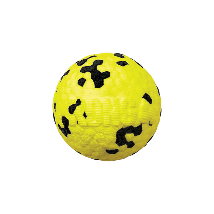 Yellow ball with black patterns on a white background